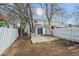 View of backyard featuring a chain link fence and sliding glass door at 2862 W Warren Ave, Denver, CO 80219