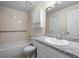 Bathroom with granite vanity, and tiled shower at 2862 W Warren Ave, Denver, CO 80219