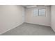 Basement bedroom featuring an egress window and spacious layout at 2862 W Warren Ave, Denver, CO 80219