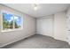 Bright bedroom featuring a spacious closet and a large window at 2862 W Warren Ave, Denver, CO 80219