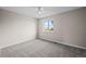 Bedroom featuring plush carpeting and a large bright window at 2862 W Warren Ave, Denver, CO 80219