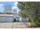 Charming exterior of a two-story home with a well-maintained lawn and attached garages at 2862 W Warren Ave, Denver, CO 80219