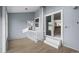 Bright living room featuring light colored floors and a sliding glass door at 2862 W Warren Ave, Denver, CO 80219