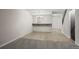 Spacious living room with hardwood floors, stylish lighting, and stairs at 2862 W Warren Ave, Denver, CO 80219