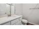 Modern bathroom features a white vanity with white countertop and a glass-enclosed shower at 3352 N Highlands Creek Pkwy, Aurora, CO 80019