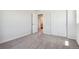 Bedroom with carpeting, featuring an open doorway and closet at 3352 N Highlands Creek Pkwy, Aurora, CO 80019