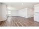 Spacious living room featuring lots of natural light and an adjoining open kitchen at 3352 N Highlands Creek Pkwy, Aurora, CO 80019
