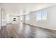 Open-concept living space with natural light, seamlessly connecting the living area and kitchen at 3352 N Highlands Creek Pkwy, Aurora, CO 80019