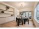 Elegant dining room with modern lighting, built-in shelves, and glass doors at 22367 Quail Run Dr, Parker, CO 80138