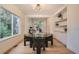 Elegant dining room with modern lighting, built-in shelves, and glass doors at 22367 Quail Run Dr, Parker, CO 80138
