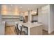 Gourmet kitchen boasts stainless appliances, expansive counters, ample cabinetry, and an island for dining and food preparation at 22367 Quail Run Dr, Parker, CO 80138