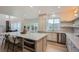 Spacious kitchen features stainless appliances, an island with seating and custom cabinets for an elegant, modern style at 22367 Quail Run Dr, Parker, CO 80138