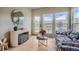 Bright living room featuring hardwood floors, modern decor, and large windows for plenty of natural light at 22367 Quail Run Dr, Parker, CO 80138