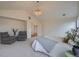 Spacious primary bedroom with natural light, elegant furnishings, and plush carpet throughout at 22367 Quail Run Dr, Parker, CO 80138