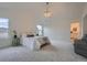 Bright primary bedroom features an ensuite bathroom and carpet floors for a cozy retreat at 22367 Quail Run Dr, Parker, CO 80138