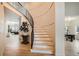 Open staircase with black railing and wood treads, leading to the upper level at 22367 Quail Run Dr, Parker, CO 80138