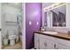 Bathroom featuring a vanity with ample storage and a shower-tub combination with a decorative curtain at 2574 E Geddes Ave, Centennial, CO 80122