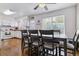 Bright dining area with hardwood floors, a modern table, and white-trimmed windows at 2574 E Geddes Ave, Centennial, CO 80122