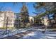 Three-story apartment building with balconies and landscaping; snow on the ground at 3082 S Wheeling Way # 410, Aurora, CO 80014