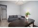 Bright office space with a desk and sectional sofa at 3082 S Wheeling Way # 410, Aurora, CO 80014