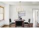 Well-lit dining area with a wooden table and four chairs at 4659 Wyandot St, Denver, CO 80211