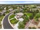 Expansive aerial view showcases this stunning home with lush greenery, manicured landscaping, and neighborhood at 8518 High Ridge, Castle Pines, CO 80108