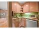 Bar area with sink, storage and appliances at 8518 High Ridge, Castle Pines, CO 80108