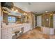 A full bathroom with separate shower, tub, and dual sinks at 8518 High Ridge, Castle Pines, CO 80108