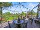 Lovely deck with outdoor kitchen and covered dining area overlooks expansive grassy yard at 8518 High Ridge, Castle Pines, CO 80108