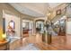 Spacious foyer featuring hardwood floors, staircase, archways leading to dining and office areas at 8518 High Ridge, Castle Pines, CO 80108