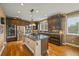 Spacious kitchen with stainless steel appliances, granite countertops, and large central island at 8518 High Ridge, Castle Pines, CO 80108