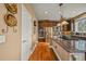 Well-equipped kitchen featuring stainless steel appliances, granite countertops, and hardwood floors at 8518 High Ridge, Castle Pines, CO 80108