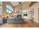 Spacious living room boasts vaulted ceilings, fireplace, and staircase to a second floor at 8518 High Ridge, Castle Pines, CO 80108