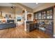 Elegant living room featuring a fireplace, high ceilings, and built-in cabinetry at 8518 High Ridge, Castle Pines, CO 80108