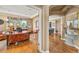 Comfortable home office featuring a unique desk, hardwood floors, and backyard views at 8518 High Ridge, Castle Pines, CO 80108