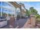 Outdoor patio with seating, a grill, and views of a well-maintained lawn at 8518 High Ridge, Castle Pines, CO 80108