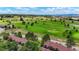 Aerial view showcasing townhouses near a golf course at 6539 Pinewood Dr # 57, Parker, CO 80134