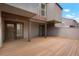 Spacious back patio with wood deck and access to unit at 6539 Pinewood Dr # 57, Parker, CO 80134