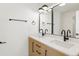 Modern bathroom with double vanity and black fixtures at 6539 Pinewood Dr # 57, Parker, CO 80134