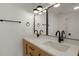 Modern bathroom with double vanity and black matte fixtures at 6539 Pinewood Dr # 57, Parker, CO 80134