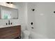 Updated bathroom with a bathtub and modern vanity at 6539 Pinewood Dr # 57, Parker, CO 80134