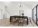 Bright dining room with dark wood table and six chairs, plus a view at 6539 Pinewood Dr # 57, Parker, CO 80134