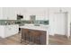 Modern kitchen with white cabinets, stainless steel appliances, and an island at 6539 Pinewood Dr # 57, Parker, CO 80134