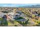 A high angle showcases a home with lush landscaping and a backyard featuring a fire pit at 16088 Denver Pacific Dr, Monument, CO 80132