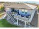 Spacious outdoor deck with stylish furniture and potted plants, perfect for relaxing and entertaining guests at 16088 Denver Pacific Dr, Monument, CO 80132