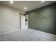 Bedroom with accent wall, neutral carpet, and stylish window treatments at 16088 Denver Pacific Dr, Monument, CO 80132
