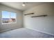 Cozy bedroom with a mountain view, sleek modern shelves, and plush carpeting at 16088 Denver Pacific Dr, Monument, CO 80132