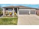 Charming single-Gathering home boasts a well-manicured lawn and a welcoming front porch with stylish decor at 16088 Denver Pacific Dr, Monument, CO 80132