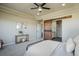 Comfortable bedroom with barn door access to bathroom, neutral colors, and tasteful decor at 16088 Denver Pacific Dr, Monument, CO 80132