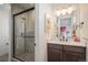 Modern bathroom featuring a glass-enclosed shower, contemporary vanity, and elegant fixtures at 3564 Doubletrack Ln, Castle Rock, CO 80108
